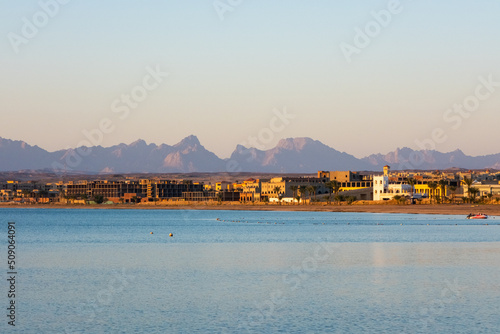 Egypt coastline. Sunset on the seashore. Coastline overlooking hotels and mountains. Sunset in the mountains. 