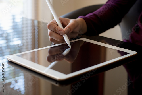 Fototapet person using digital tablet
