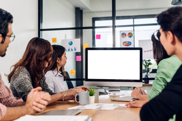 Group of professional asian business meeting and discussing strategy with new startup project.Creative business people planning with desktop computer with white mockup blank screens in modern office