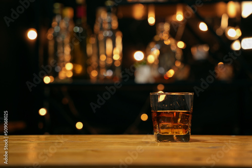 Barman pouring whiskey glass beautiful night photo