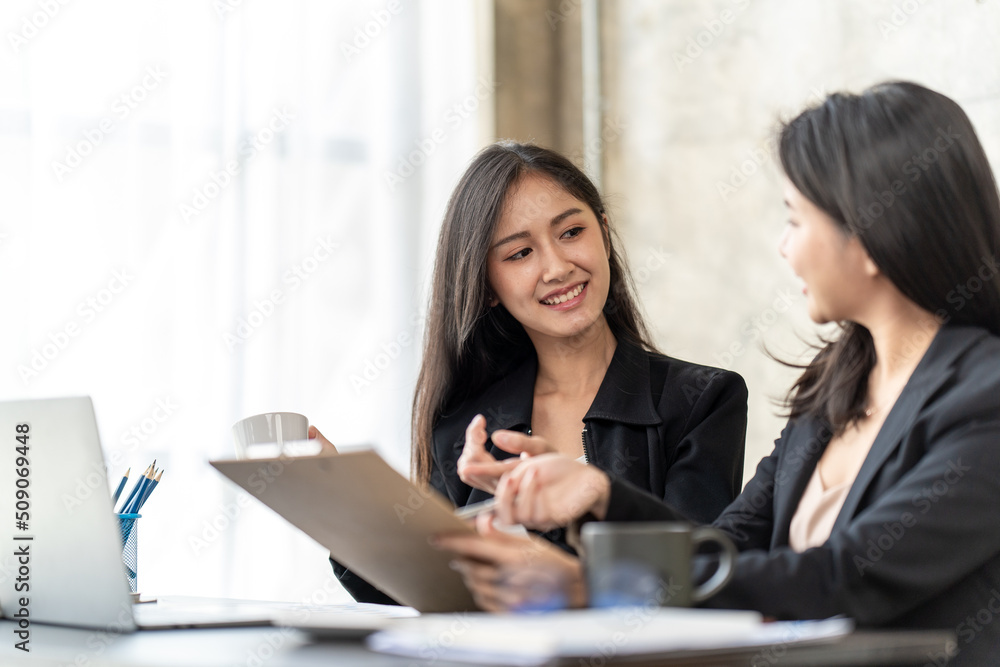 Asian business people meeting in office, Young broker businesswoman talking to business partners. Woman consulting, giving instructions, explaining terms of contract. Asian business people meeting in office, Young broker businesswoman talking to business partners. Woman consulting, giving instructions, explaining terms of contract.