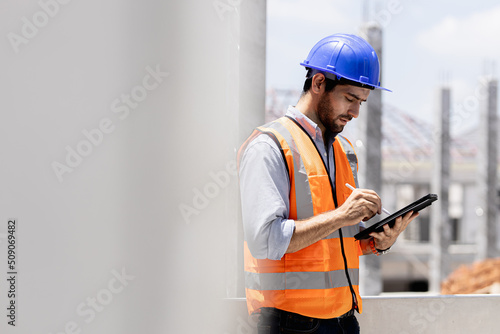 Wallpaper Mural A portrait of an industrial man engineer with smartphone in a site house, working. Torontodigital.ca