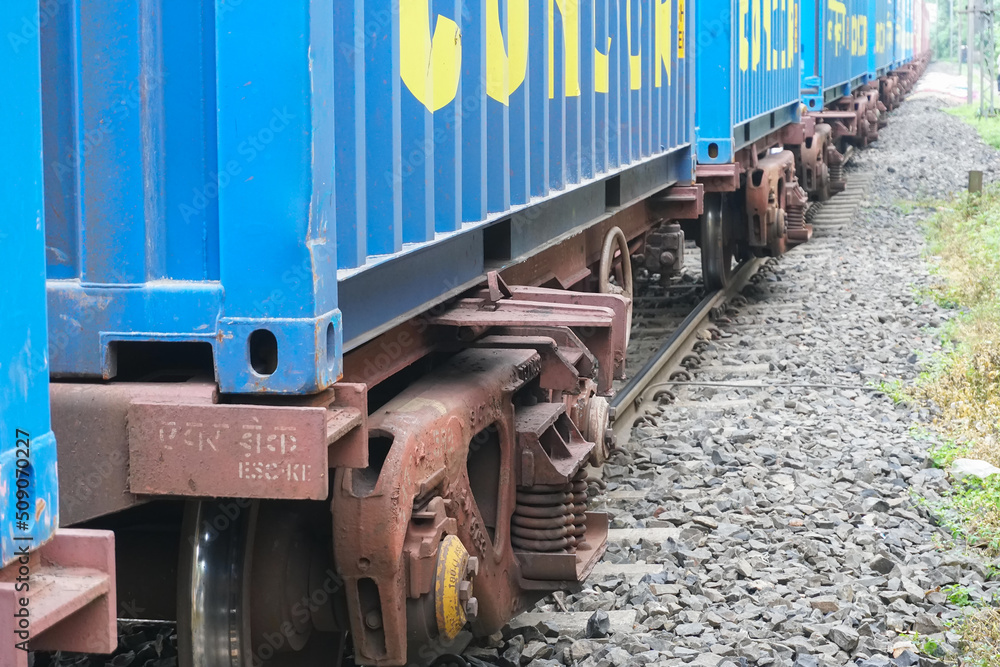 Howrah, West Bengal , India - 19th August 2018 : A railway wagon is passing through railway tracks. Huge Industrial goods are carried across the country by wagons and helps industry to reduce cost. Howrah, West Bengal , India - 19th August 2018 : A railway wagon is passing through railway tracks. Huge Industrial goods are carried across the country by wagons and helps industry to reduce cost.