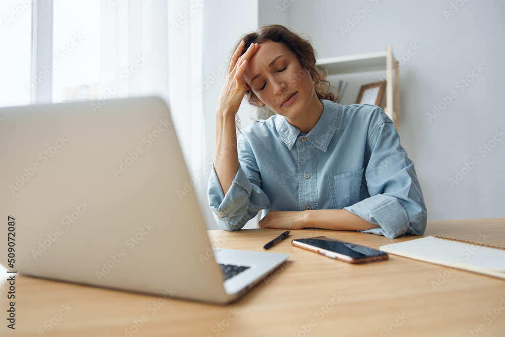 Offended angry curly haired woman business lady office worker tired of hard work sleeplessness professional burnout depression working at home. Feel down stressed suffer from mental troubles concept Offended angry curly haired woman business lady office worker tired of hard work sleeplessness professional burnout depression working at home. Feel down stressed suffer from mental troubles concept