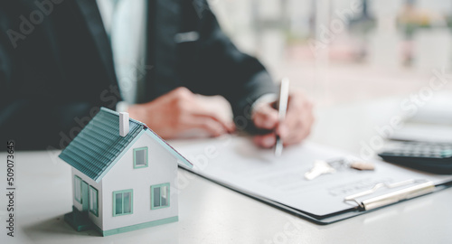 Real estate agents present and consult with clients to decide whether to sign an insurance contract. house trading About Mortgage and Home Insurance Offers