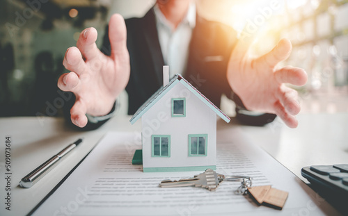 Real estate agents present and consult with clients to decide whether to sign an insurance contract. house trading About Mortgage and Home Insurance Offers