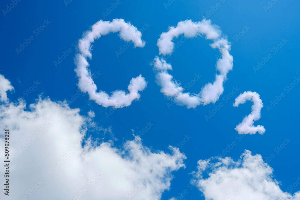 Blue sky with word CO2 . Global warming concept. Natural disasters and cataclysms Blue sky with word CO2 . Global warming concept. Natural disasters and cataclysms