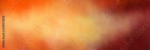 Orange and purple background. Autumn or fall warm colors in blurred cloudy sky illustration. Sunrise or sunset with stormy cloud design. Abstract colorful background with blur texture. photo