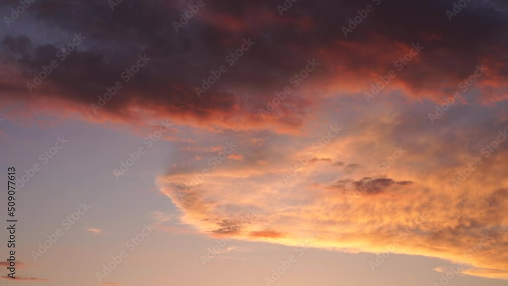 Beautiful evening blue sky at sunset with flaming bright light clouds. A warm summer evening at sunset. Bright sunset.
Beautiful evening blue sky at sunset with flaming bright light clouds. A warm summer evening at sunset. Bright sunset.