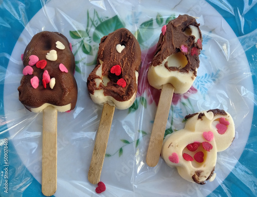 Chocolate lollipop with colored hearts