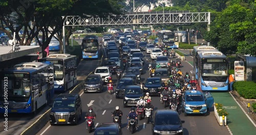 Busy traffic with chaotic vehicles scrambling on the highway