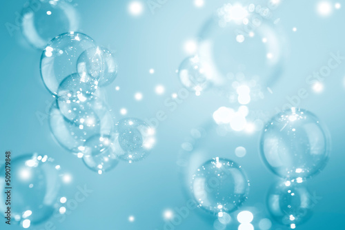 Beautiful Shiny Transparent Blue Soap Bubbles Background. Soap Sud Bubbles Water. 