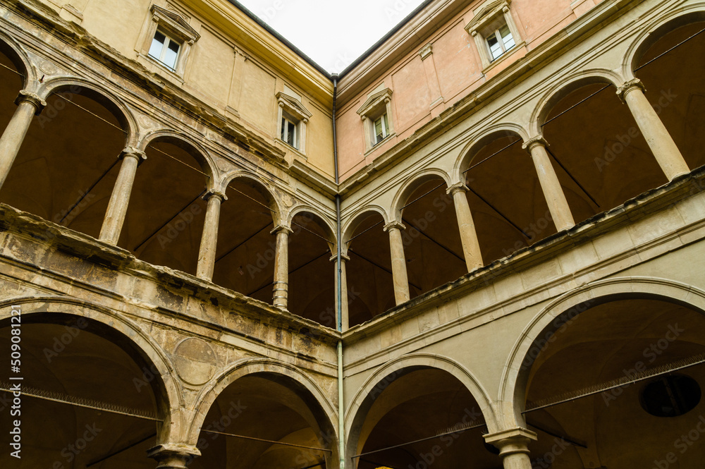 Arches of a renaissance courtyard at one of the old building of the Bologna university