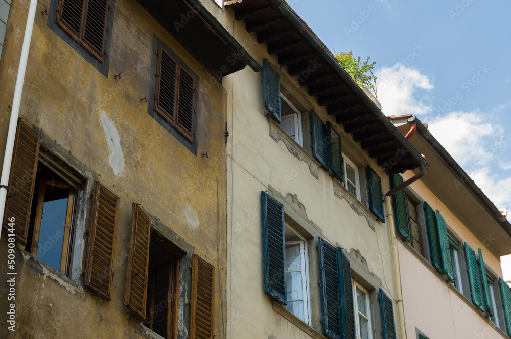 Naklejka premium Facades with wooden window shutters in Florence, Italy