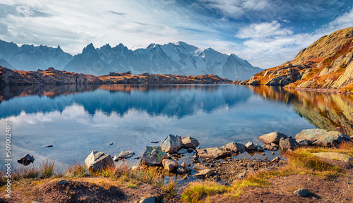 Astonishing autumn view of Chesery lake/Lac De Chesery, Chamonix location. Calm outdoor scene of Vallon de Berard Nature Preserve, Graian Alps, France, Europe. Beauty of nature concept background..