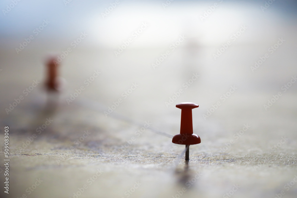 Travel concept. Map and needle with a marked place. Compass point on the map and routes. Travel concept. Map and needle with a marked place. Compass point on the map and routes.