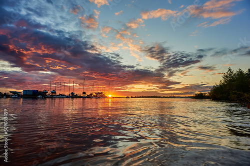 beautiful sunset on the sea on the background of yachts © Евгений Порохин