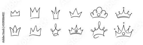 Hand drawn doodle crowns set. King crown sketches, majestic tiara, king and queen royal diadems. Vector illustration isolated in doodle style on white background.