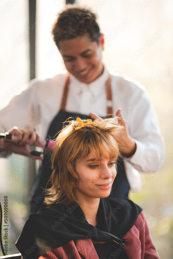 Fototapeta premium concept of professional fashion hairdresser and hair beauty salon, hairstylist making treatment to woman client person, by using scissors for haircut and coiffure care, girl style in studio lifestyle