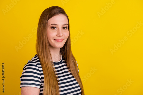 Profile side photo of young lovely girl promoter wear modern outfit isolated over yellow color background © Tetiana