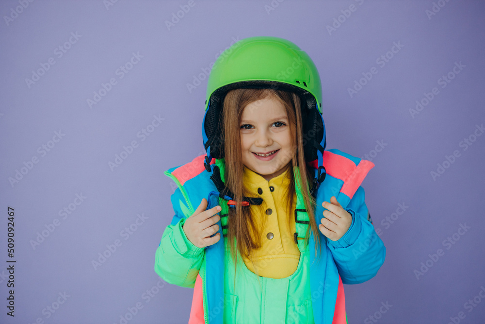 Cute little girl wearing ski wear isolated in studio Cute little girl wearing ski wear isolated in studio