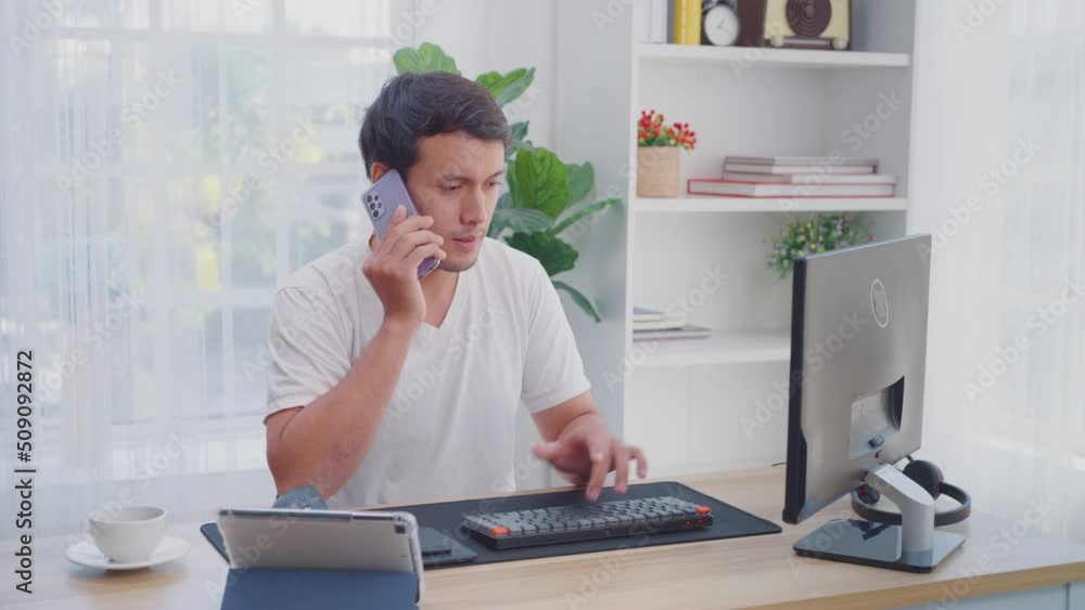 Man busy at work, Anxious, Tired working at home Man busy at work, Anxious, Tired working at home