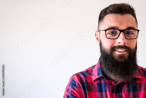 Portrait of happy man who is smiling. Copy space on image for your text or advert.