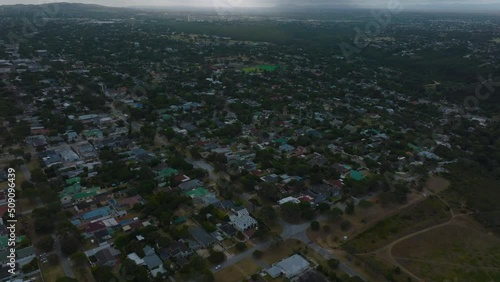 High angle view of residential borough. Family houses with gardens and grown green trees. Port Elisabeth, South Africa