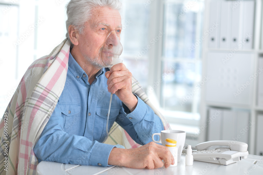 Elderly man doing inhalation Elderly man doing inhalation