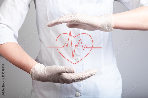 ECG concept. Doctor holding heart with heartbeat rhythm between hands in gloves. Electrocardiogram test conducting. Heart disease, attack detection. High quality photo