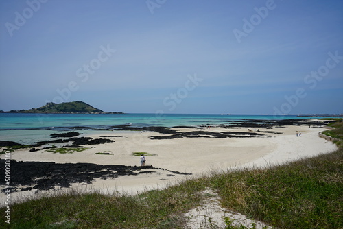 shoaling beach and people and island