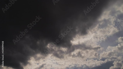 Timelapse of a dramatic weather change from blue sky to a dark dramatic storm sky