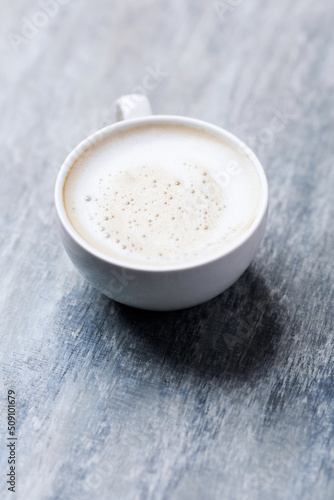Coffee with milk on wooden background. Soft focus. Close up. Copy space.                              