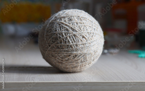 A ball of woolen threads on the table.