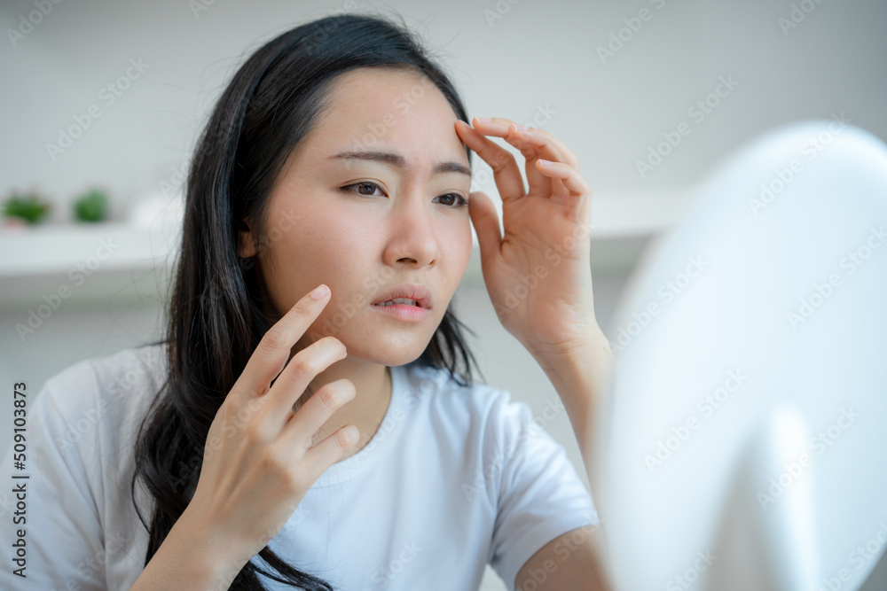 Young woman asian are worried about faces Dermatology and allergic to steroids in cosmetics. sensitive skin,red face from sunburn, acne,allergic to chemicals,rash on face. skin problems and beauty Young woman asian are worried about faces Dermatology and allergic to steroids in cosmetics. sensitive skin,red face from sunburn, acne,allergic to chemicals,rash on face. skin problems and beauty