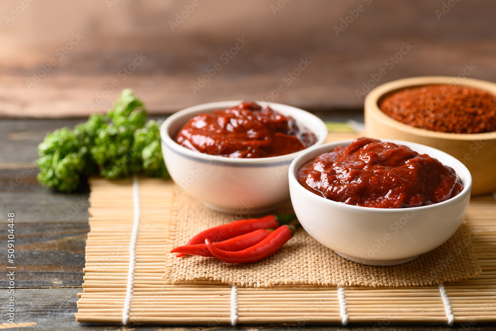Korean gochujang (red chili paste), spicy and sweet fermented condiment in Korean food Korean gochujang (red chili paste), spicy and sweet fermented condiment in Korean food