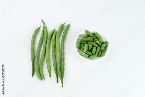 Buncis or Fresh raw string bean, legumes contain protein on white background.
 photo