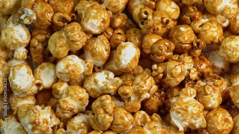 Coffee taste popcorns rotating close up. Caramel popcorn. Healthy food for morning breakfast. Healthy breakfast concept. High quality 4k footage Coffee taste popcorns rotating close up. Caramel popcorn. Healthy food for morning breakfast. Healthy breakfast concept. High quality 4k footage