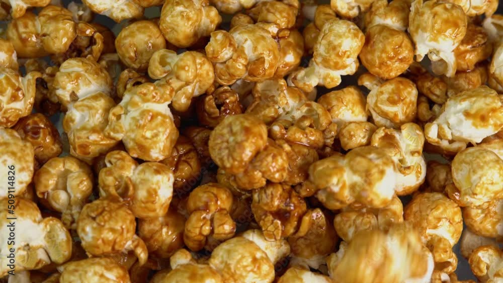 Coffee taste popcorns falls close up. Caramel popcorn. Healthy food for morning breakfast. Healthy breakfast concept. High quality 4k footage Coffee taste popcorns falls close up. Caramel popcorn. Healthy food for morning breakfast. Healthy breakfast concept. High quality 4k footage