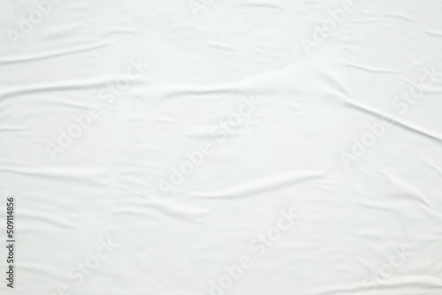 white crumpled and creased paper poster texture background © Piman Khrutmuang