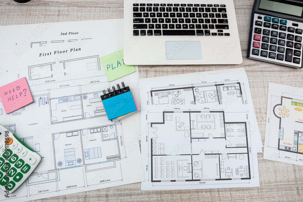 Fototapeta premium designers work as a team on drawings and designs of new house projects.