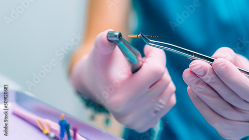 Canvastavla An Endodontist Holding Barbed Broach, Root Canal Treatment in Dental Clinic
