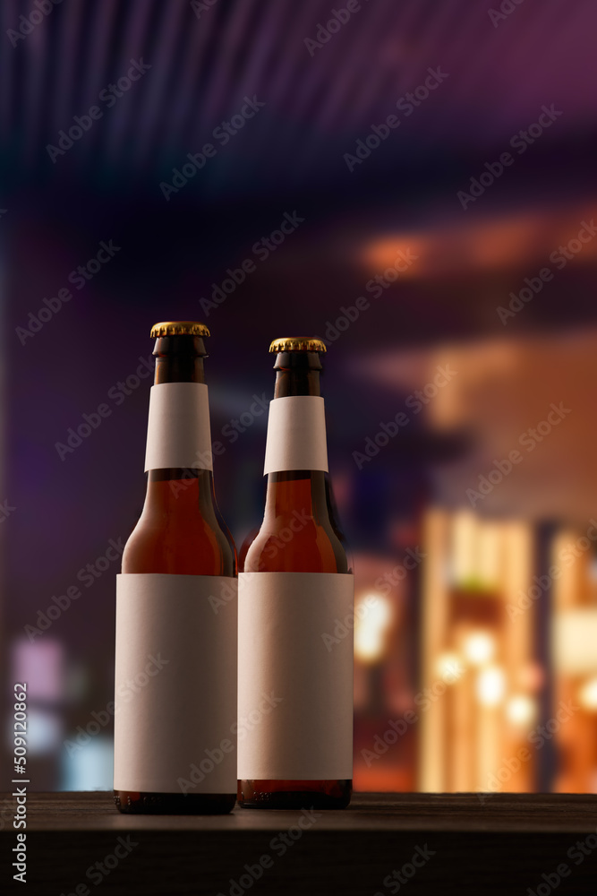 Two bottle of beer on counter in pub.