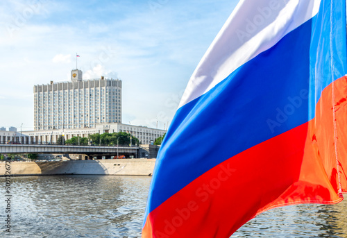 Russian flag on the background of the White House (House of the Government of the Russian Federation), Moscow, Russia