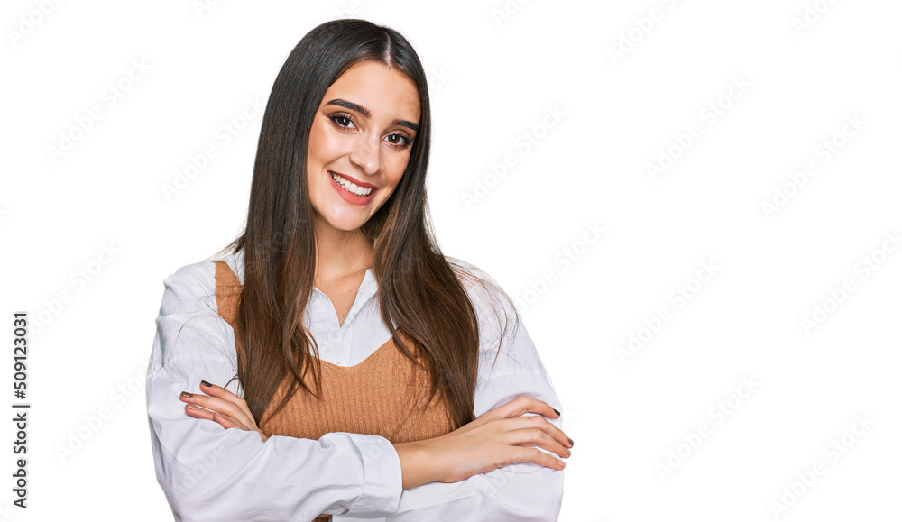 Young beautiful woman wearing casual white shirt happy face smiling with crossed arms looking at the camera. positive person. Young beautiful woman wearing casual white shirt happy face smiling with crossed arms looking at the camera. positive person.