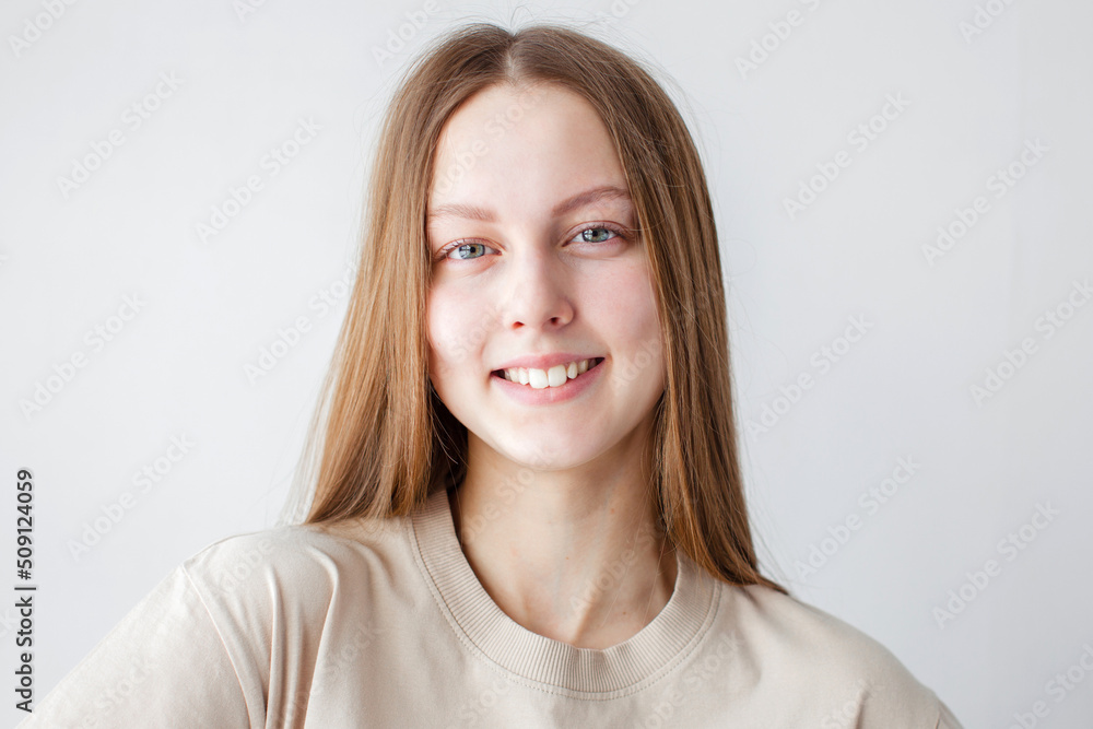 Portrait of young beautiful cute cheerful girl smiling over white background Portrait of young beautiful cute cheerful girl smiling over white background