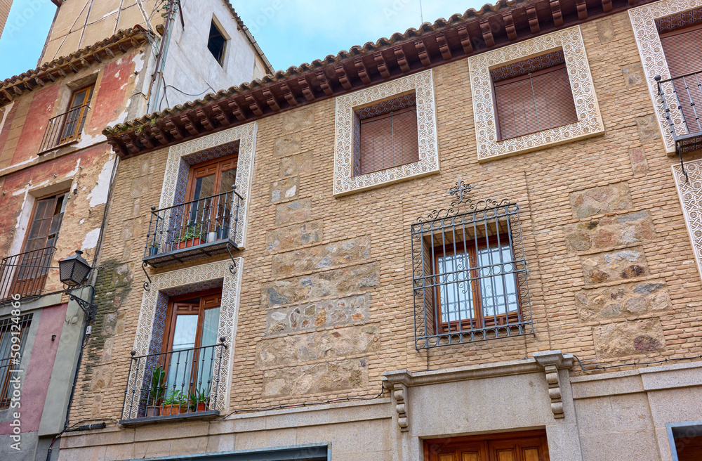 A facade decorated with Sgraffito, an architectural ornamental technique used to decorate the plastering and covering of walls. Toledo, Castilla La Mancha, Spain.