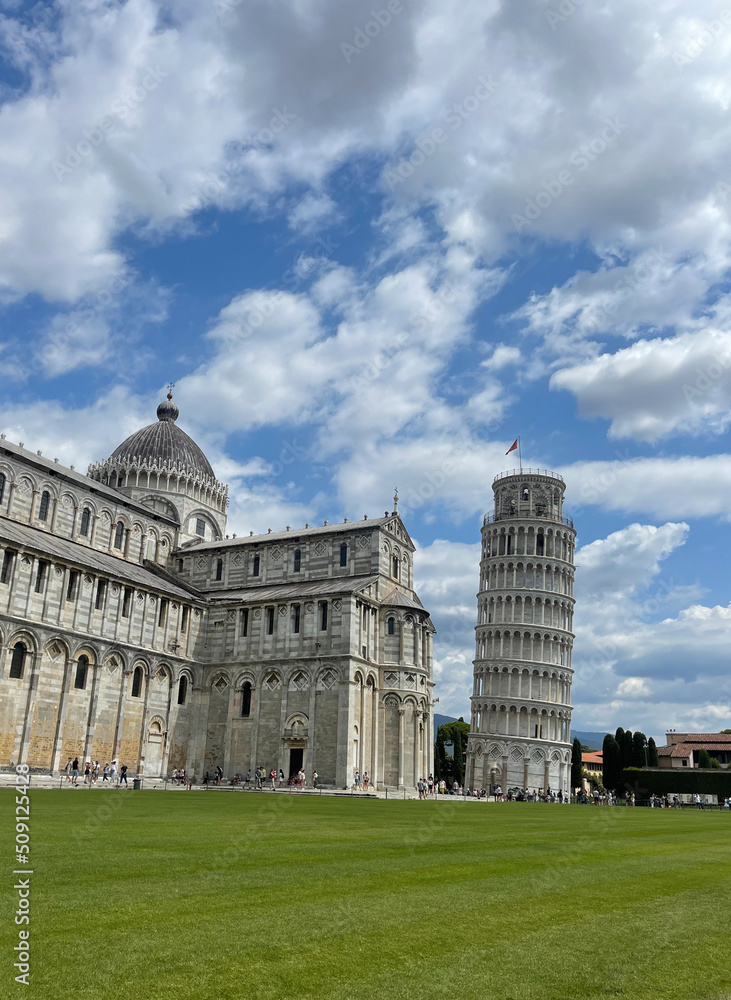tourists visiting leaning tower of Pisa and miracle square