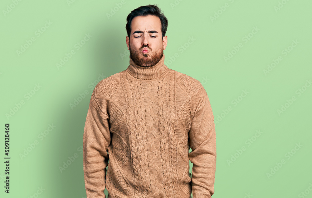 Young hispanic man wearing casual clothes making fish face with lips, crazy and comical gesture. funny expression. Young hispanic man wearing casual clothes making fish face with lips, crazy and comical gesture. funny expression.