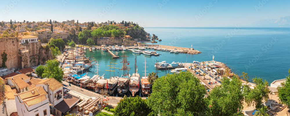 Fototapeta premium Aerial view of the picturesque bay with marina port with yachts near the old town of Kaleici in Antalya. Turkish Riviera and resort paradise
